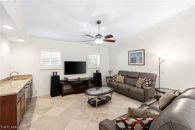 living room with ceiling fan and sink