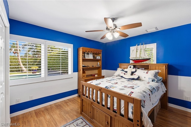 bedroom featuring ceiling fan and hardwood / wood-style floors