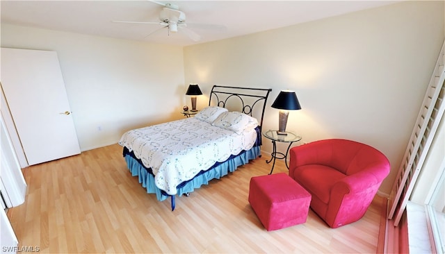 bedroom with ceiling fan and light wood-type flooring