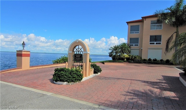 view of home's community with a water view