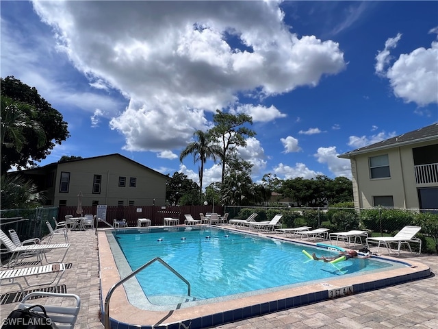 view of swimming pool featuring a patio area