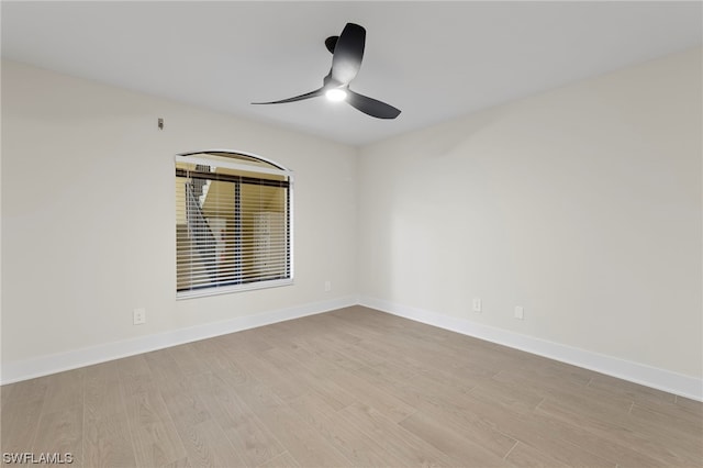 spare room featuring ceiling fan and light wood-type flooring