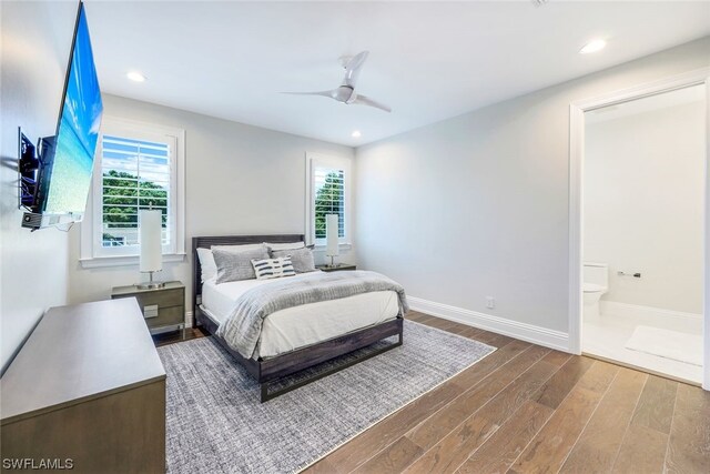 bedroom with ensuite bath, wood-type flooring, and ceiling fan