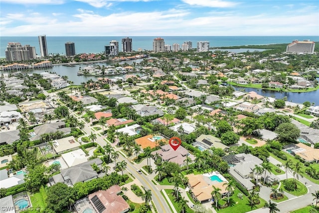 birds eye view of property with a water view