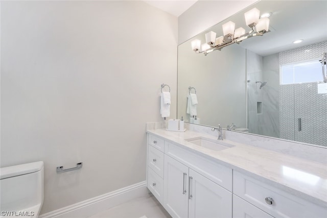 bathroom featuring toilet, a shower with door, and vanity