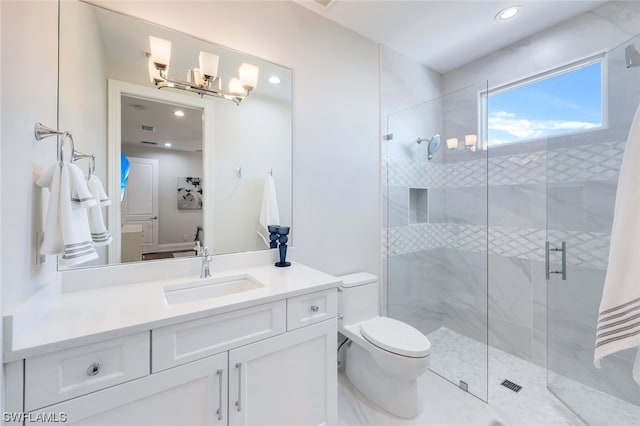 bathroom with an enclosed shower, oversized vanity, and toilet