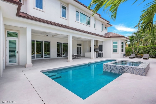 view of swimming pool featuring a patio area, an in ground hot tub, and ceiling fan