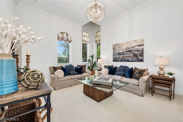 living room with an inviting chandelier, ornamental molding, and light colored carpet