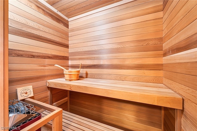 view of sauna / steam room featuring wood walls