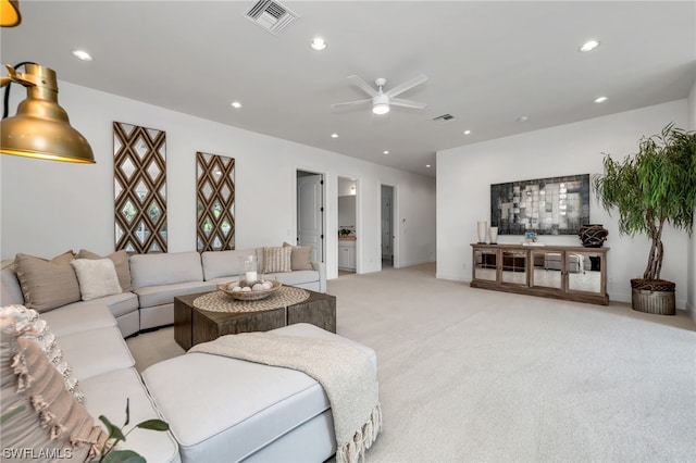 living room with light colored carpet and ceiling fan