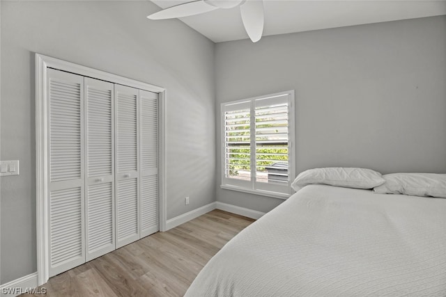 bedroom with ceiling fan, a closet, and light wood-type flooring