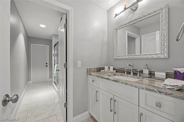 bathroom with vanity and tile patterned floors