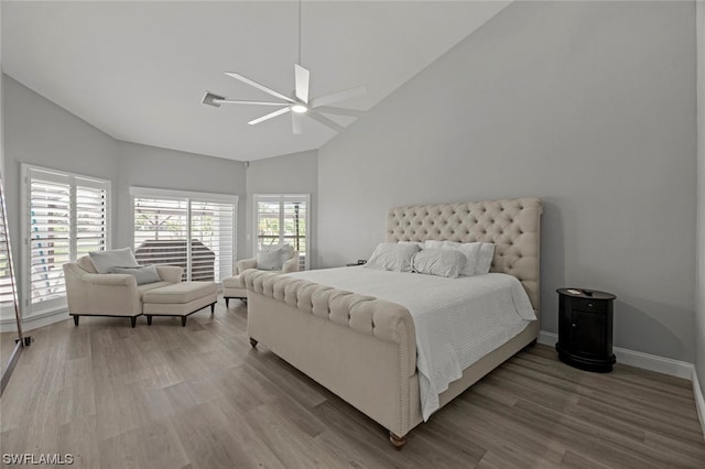 bedroom featuring lofted ceiling, wood-type flooring, and ceiling fan