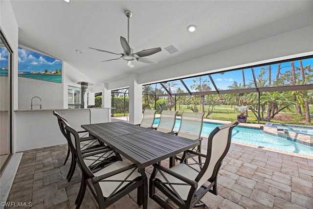 view of patio featuring visible vents, outdoor dry bar, a ceiling fan, a pool with connected hot tub, and a lanai