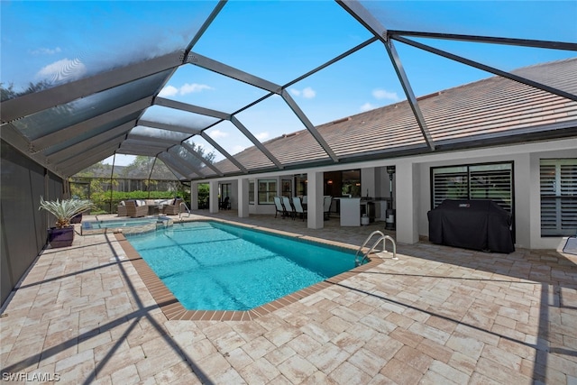 view of swimming pool with outdoor lounge area, a patio area, grilling area, and a lanai