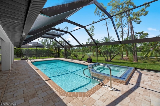 view of pool featuring an in ground hot tub, a lanai, and a patio