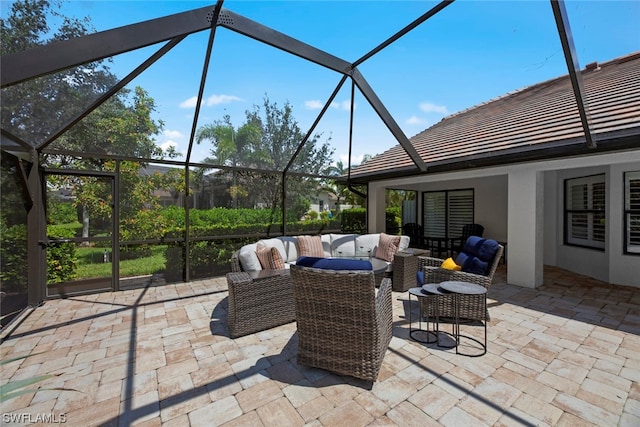 view of patio / terrace with glass enclosure and an outdoor hangout area