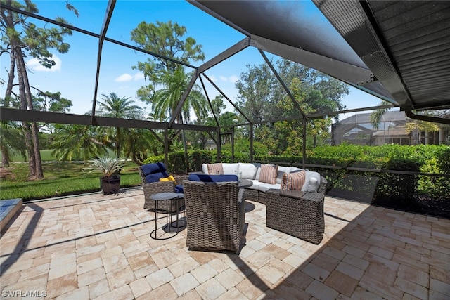 view of patio with an outdoor living space and glass enclosure