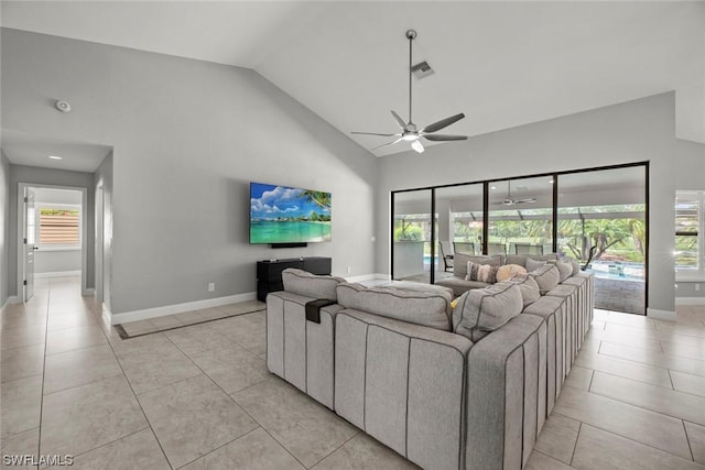 living room with light tile patterned flooring, visible vents, high vaulted ceiling, and a ceiling fan