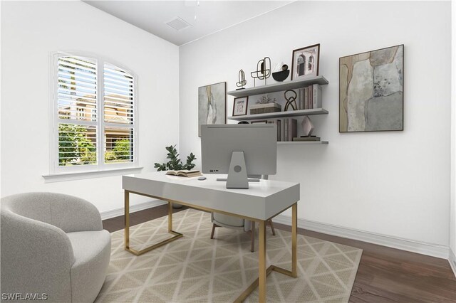 home office with hardwood / wood-style floors