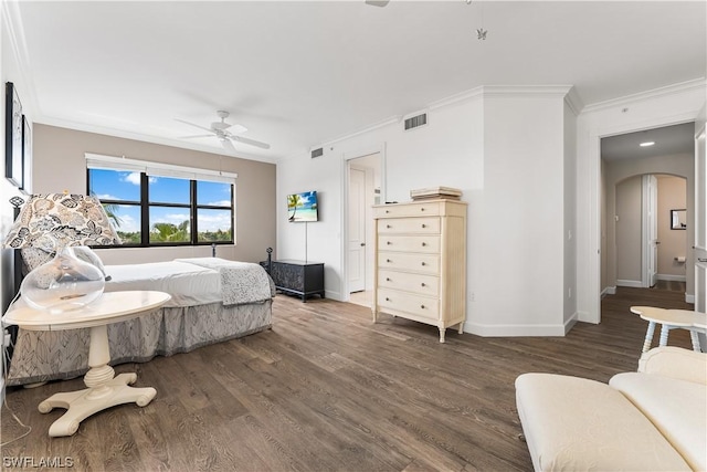 bedroom featuring crown molding, dark hardwood / wood-style floors, and ceiling fan