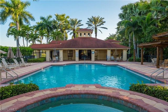 view of swimming pool featuring a patio area