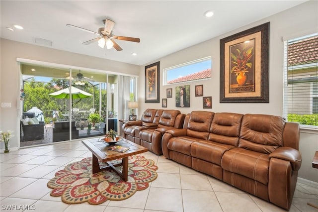 tiled living room with ceiling fan