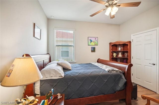 bedroom featuring hardwood / wood-style flooring and ceiling fan