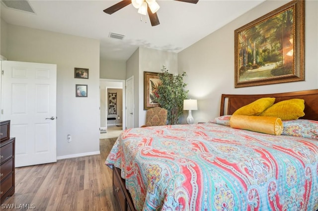 bedroom with ceiling fan and light wood-type flooring