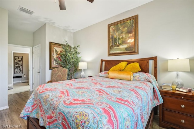 bedroom featuring ceiling fan and hardwood / wood-style flooring