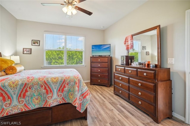 bedroom with ceiling fan and light hardwood / wood-style floors