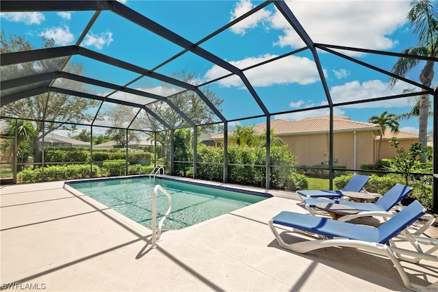 view of pool with a lanai and a patio area