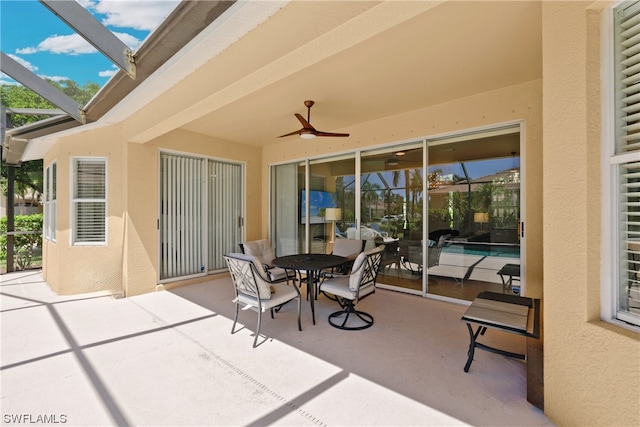 view of patio with a lanai and ceiling fan