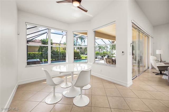 sunroom featuring ceiling fan