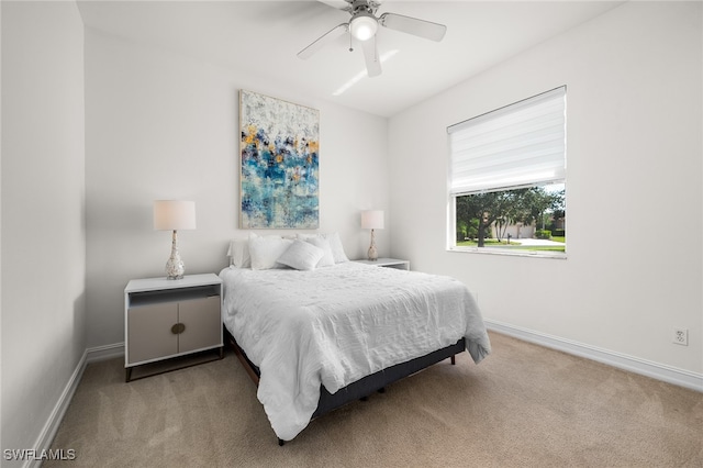 bedroom featuring ceiling fan and light colored carpet