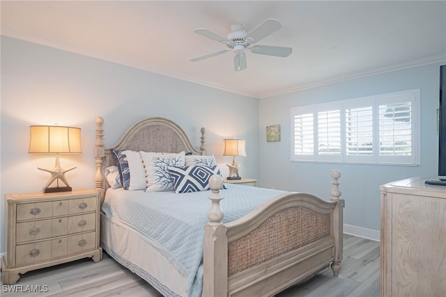 bedroom featuring ornamental molding, ceiling fan, and light hardwood / wood-style flooring