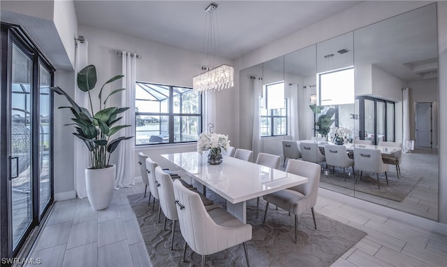 dining area with an inviting chandelier and a wealth of natural light