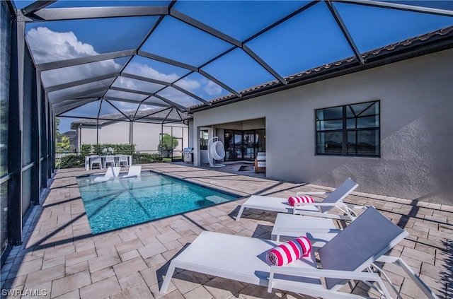 view of pool featuring a lanai and a patio