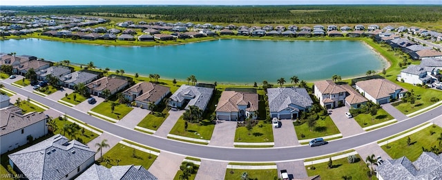 birds eye view of property with a water view