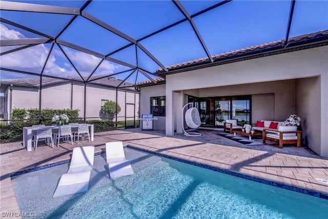 view of swimming pool featuring a lanai, an outdoor living space, and a patio