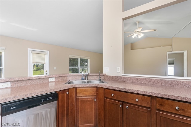 kitchen featuring dishwasher, ceiling fan, lofted ceiling, and sink