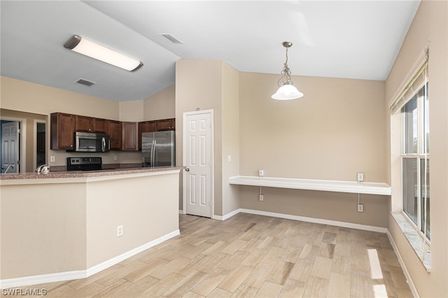 kitchen featuring kitchen peninsula, appliances with stainless steel finishes, light wood-type flooring, vaulted ceiling, and pendant lighting