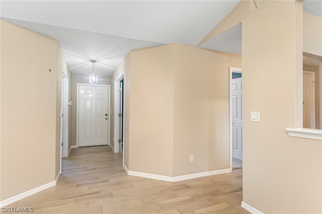 hall with light hardwood / wood-style flooring