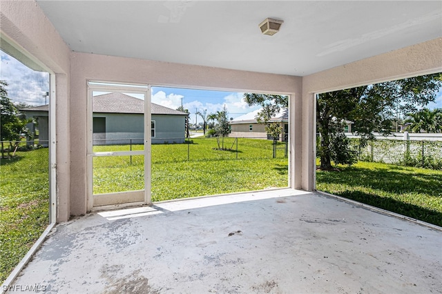 unfurnished sunroom with a wealth of natural light