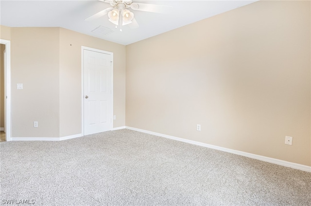 carpeted empty room featuring ceiling fan