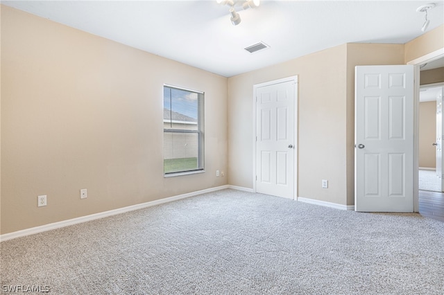 unfurnished bedroom featuring carpet flooring