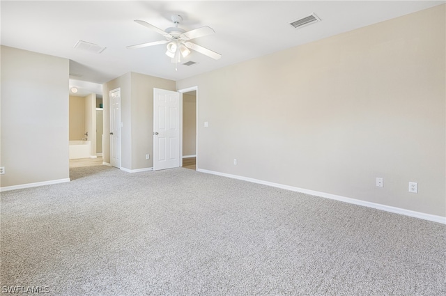 empty room with ceiling fan and light colored carpet