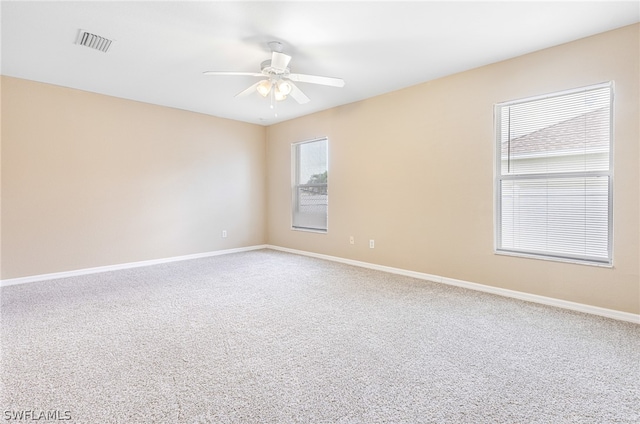 carpeted empty room with ceiling fan