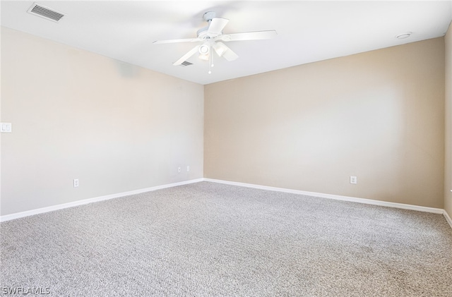 carpeted empty room featuring ceiling fan