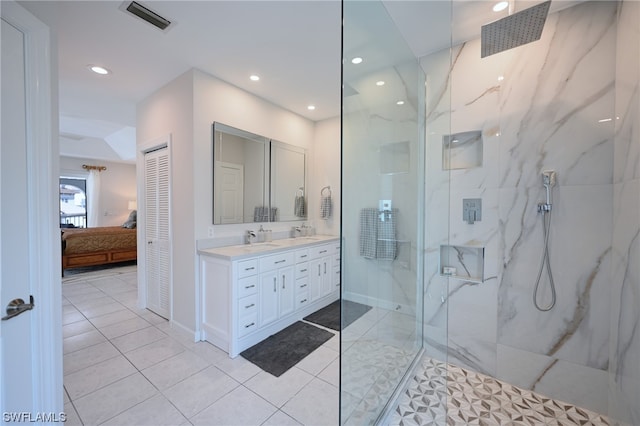 bathroom featuring walk in shower, tile floors, and vanity